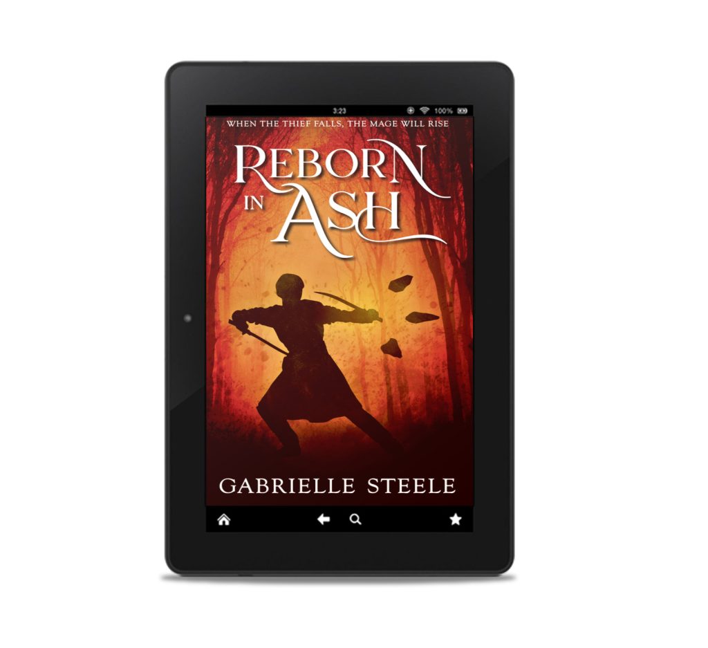 A mockup of a generic tablet showing the cover of Reborn in Ash by Gabrielle Steele. The background is dark with a red-orange glow in a gap between the silhouettes of trees. The silhouette of a person fills most of the space between the trees. They are in an action stance, with twin swords raised, one either side, curving towards them defensively. One arm extends to the right, where three pointed stones hover, their tips aimed away from the person.